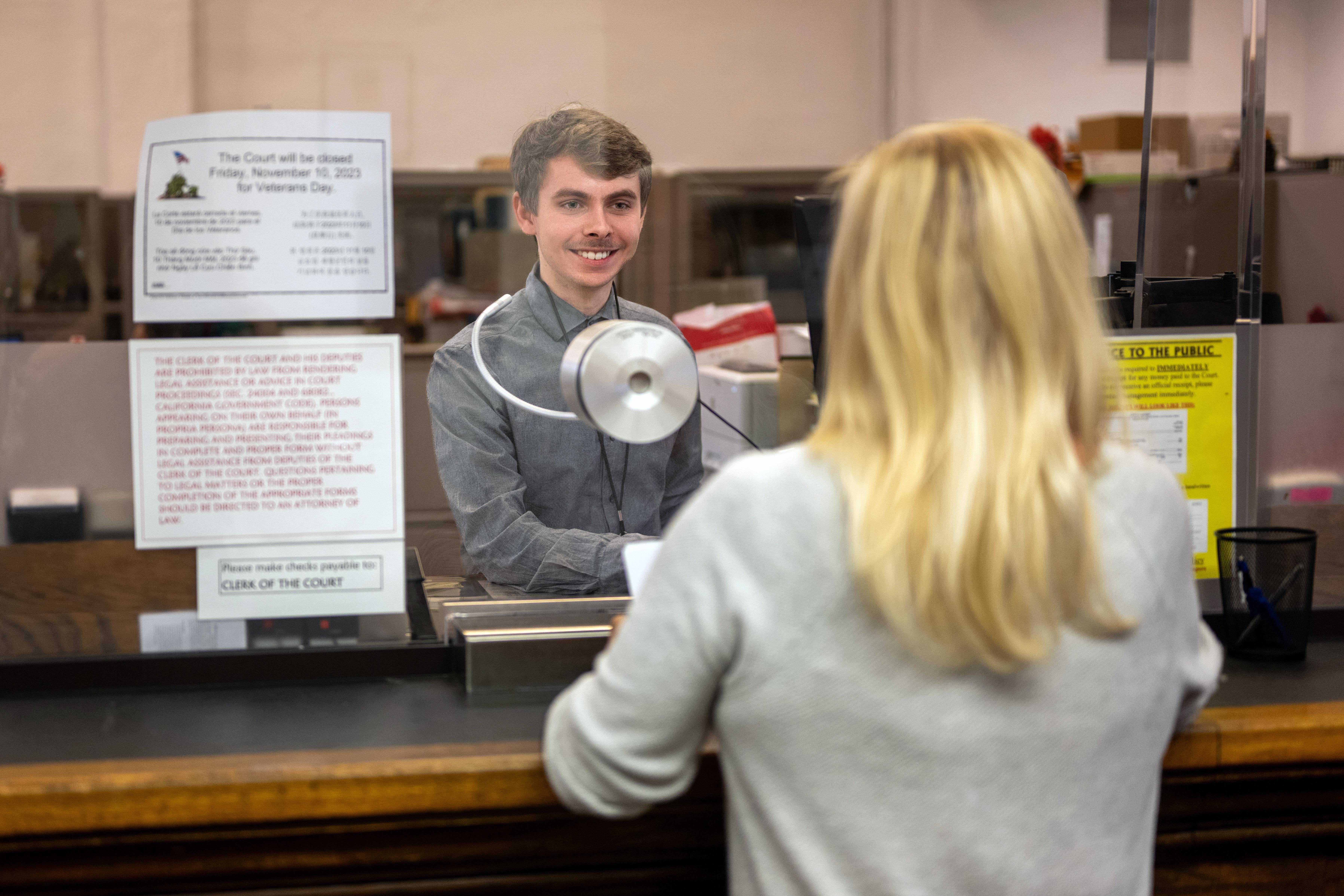 A court clerk assists a visitor at Santa Barbara County Superior Court.